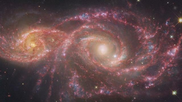 Hubble and Webb imagery of galaxy pair resembles creepy 'blood red eyes'