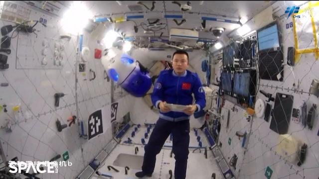 Chinese astronauts test 'intelligent flight robot,' check on fruit flies