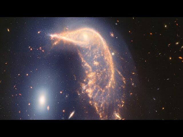 Pan of Interacting galaxies Arp 142 (NIRCam and MIRI image)